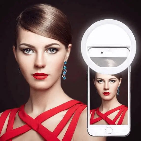 Clip-on LED light for phone cameras. Improves selfies & videos with bright, even light. Perfect for low light or makeup application.