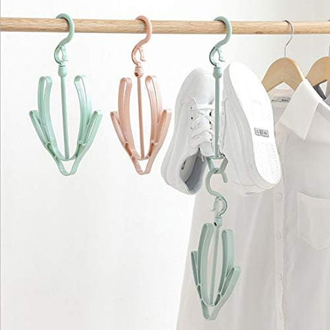 Plastic shoe hanger for drying shoes at home. Doubles as a hook.